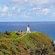A lighthouse on a bluff on the island of Kauai